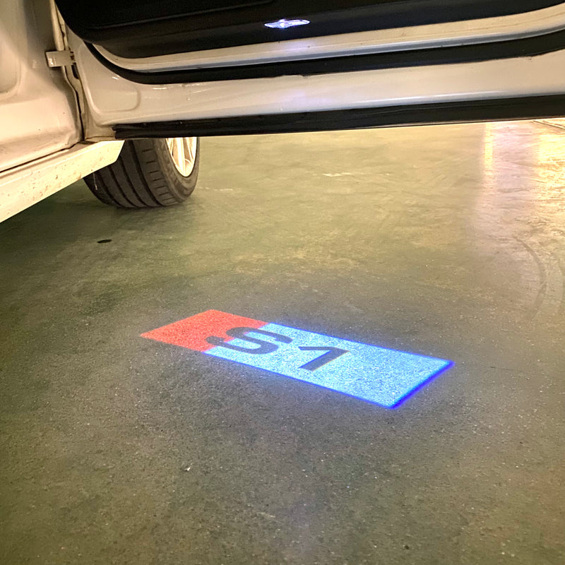 AUDI S1  LOGO PROJECTOT LIGHTS Nr.127  (quantity 1 = 2 Logo Films /2 door lights）