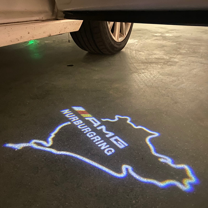 MERCEDES BENZ AMG NÜRBURGRING LOGO PROJECTOT LIGHTS Nr.01 (quantità 1 = 1 set/2 luci porta)