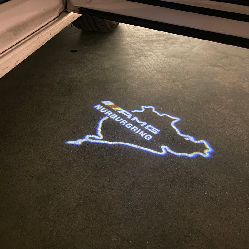 MERCEDES BENZ AMG NÜRBURGRING LOGO PROJECTOT LIGHTS Nr.01 (quantità 1 = 1 set/2 luci porta)