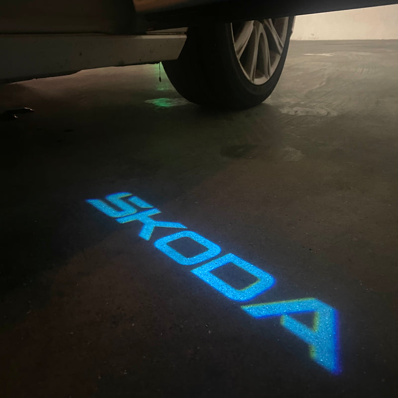 SKODA ORIGINAL LOGO PROJECTOT LIGHTS Nr.857(quantity  1 =  2 Logo Film /  2 door lights)