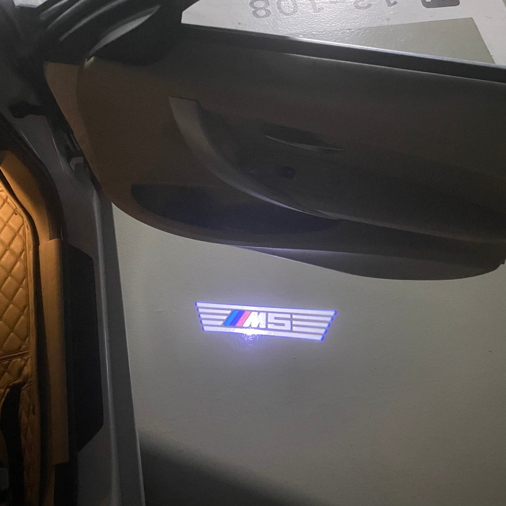 BMW 5 SERIES M5 LOGO PROJECTOT LIGHTS (quantity 1 = 1 sets/2 door lights)Nr.bmw00259