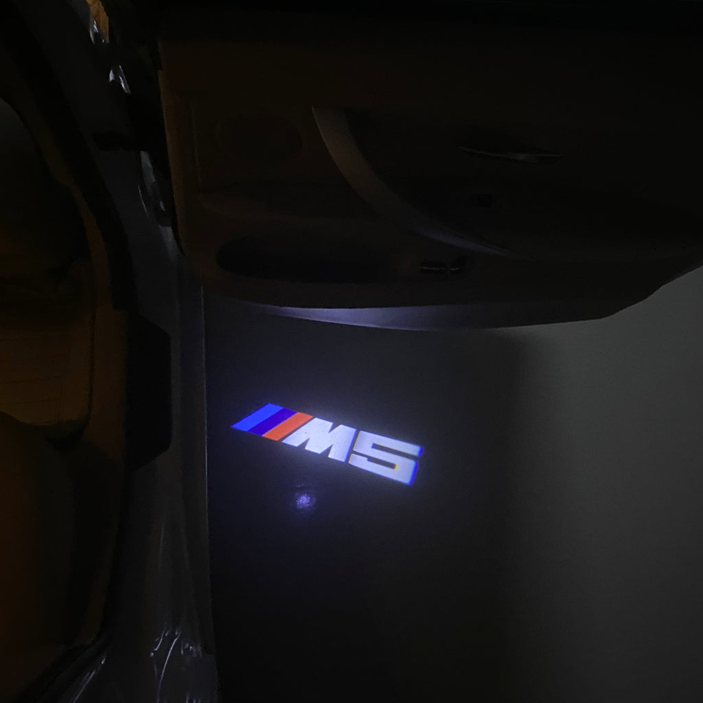 BMW  5 SERIES M5 LOGO PROJECTOT LIGHTS (quantity 1 = 1 sets/2 door lights)Nr.bmw00237