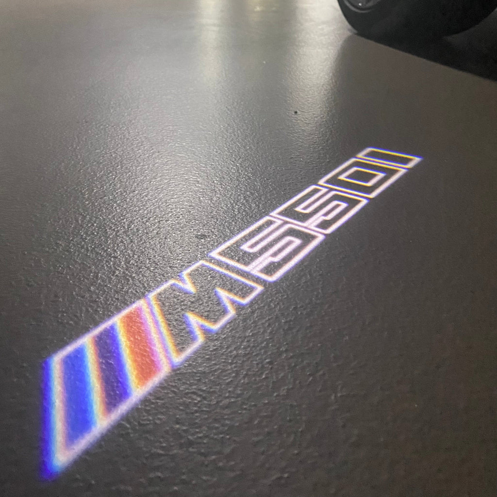 BMW   5 SERIES M550 i   LOGO PROJECTOT LIGHTS (quantity 1 = 1 sets/2 door lights)Nr.bmw00322