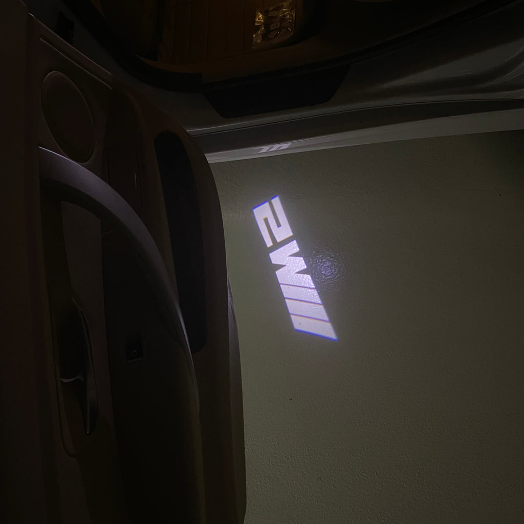 BMW 2 SERIES M2  LOGO PROJECTOT LIGHTS (quantity 1 = 1 sets/2 door lights)Nr.bmw00214