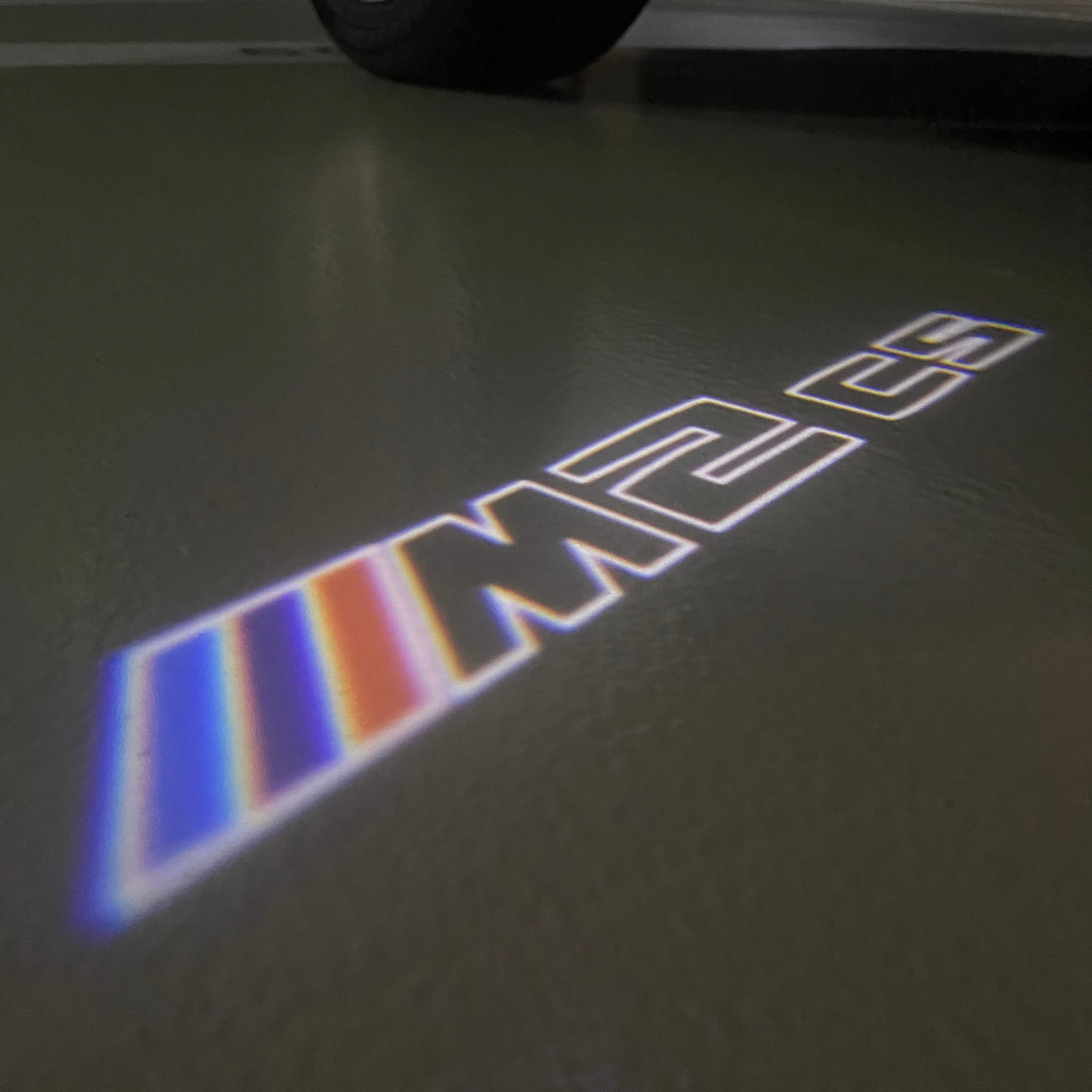 BMW  2 SERIES M2 LOGO PROJECTOT LIGHTS (quantity 1 = 1 sets/2 door lights)Nr.bmw00199