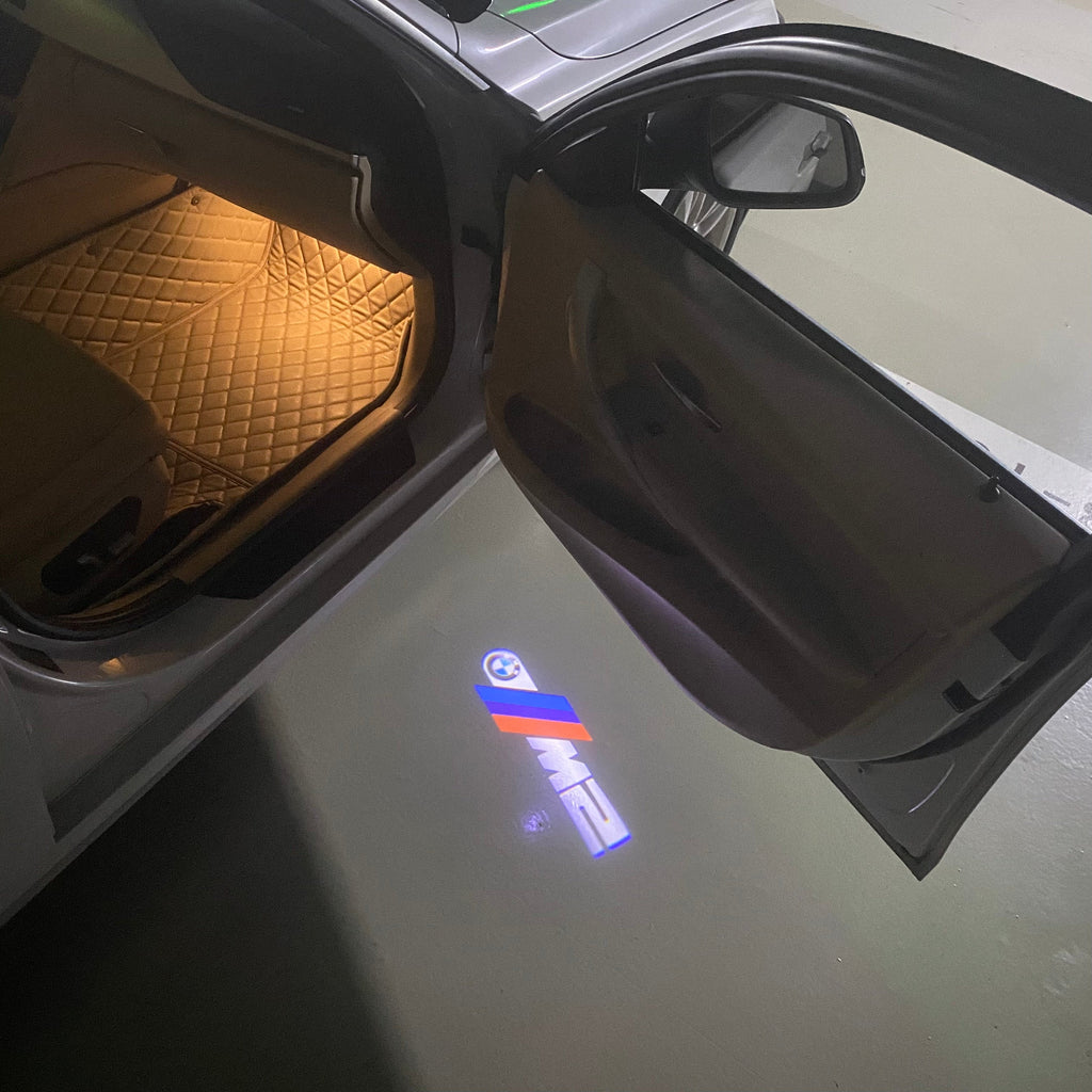 BMW  2 SERIES M2 LOGO PROJECTOT LIGHTS (quantity 1 = 1 sets/2 door lights)Nr.bmw00140
