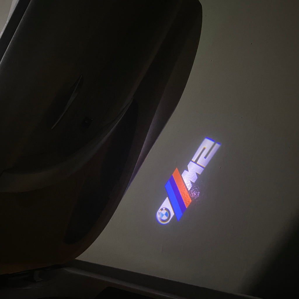 BMW  2 SERIES M2 LOGO PROJECTOT LIGHTS (quantity 1 = 1 sets/2 door lights)Nr.bmw00140