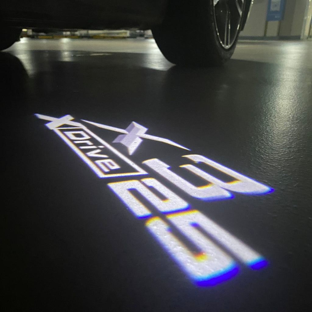 BMW X3 X drive 25  LOGO PROJECTOT LIGHTS (quantity 1 = 1 sets/2 door lights)Nr.bmw0055