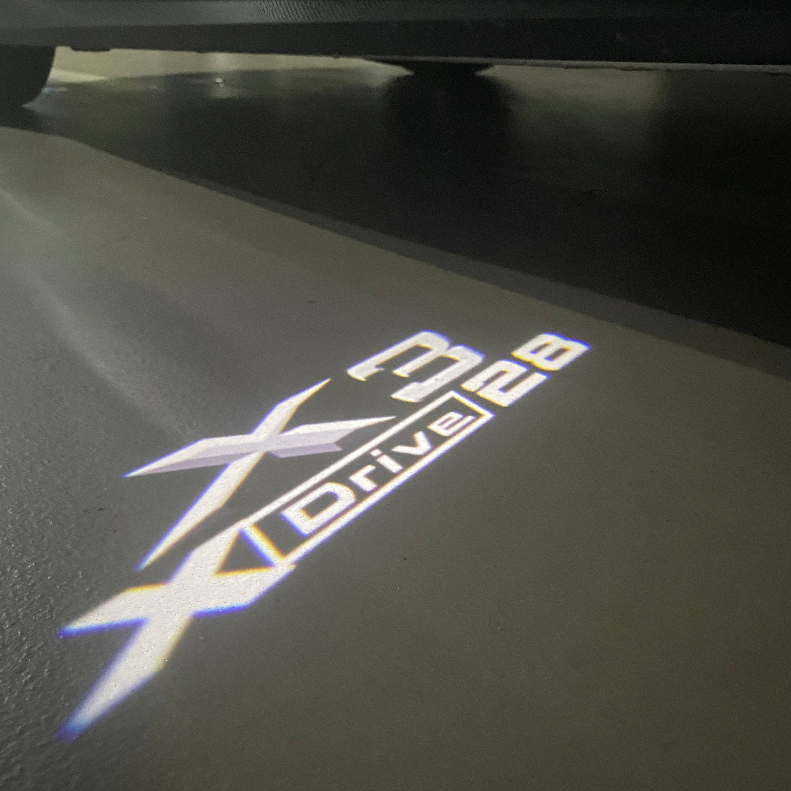 BMW  X3 X drive 28  LOGO PROJECTOT LIGHTS (quantity 1 = 1 sets/2 door lights)Nr.bmw0054