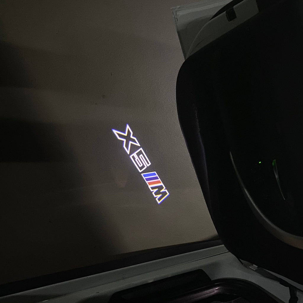 BMW X5M LOGO PROJECTOT LIGHTS (quantity 1 = 1 sets/2 door lights)Nr.bmw00108