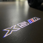 BMW X5M LOGO PROJECTOT LIGHTS (quantity 1 = 1 sets/2 door lights)Nr.bmw00108