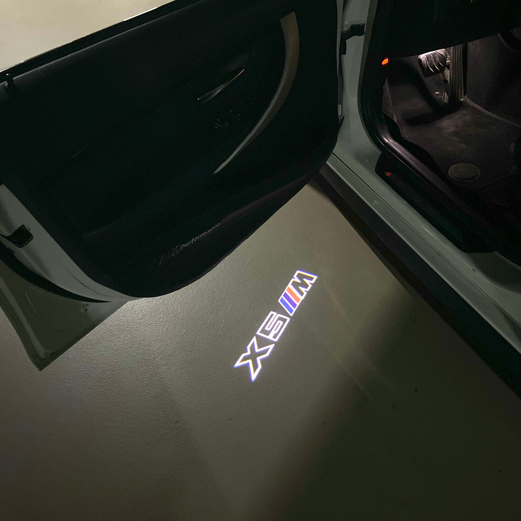 BMW X5M LOGO PROJECTOT LIGHTS (quantity 1 = 1 sets/2 door lights)Nr.bmw00108