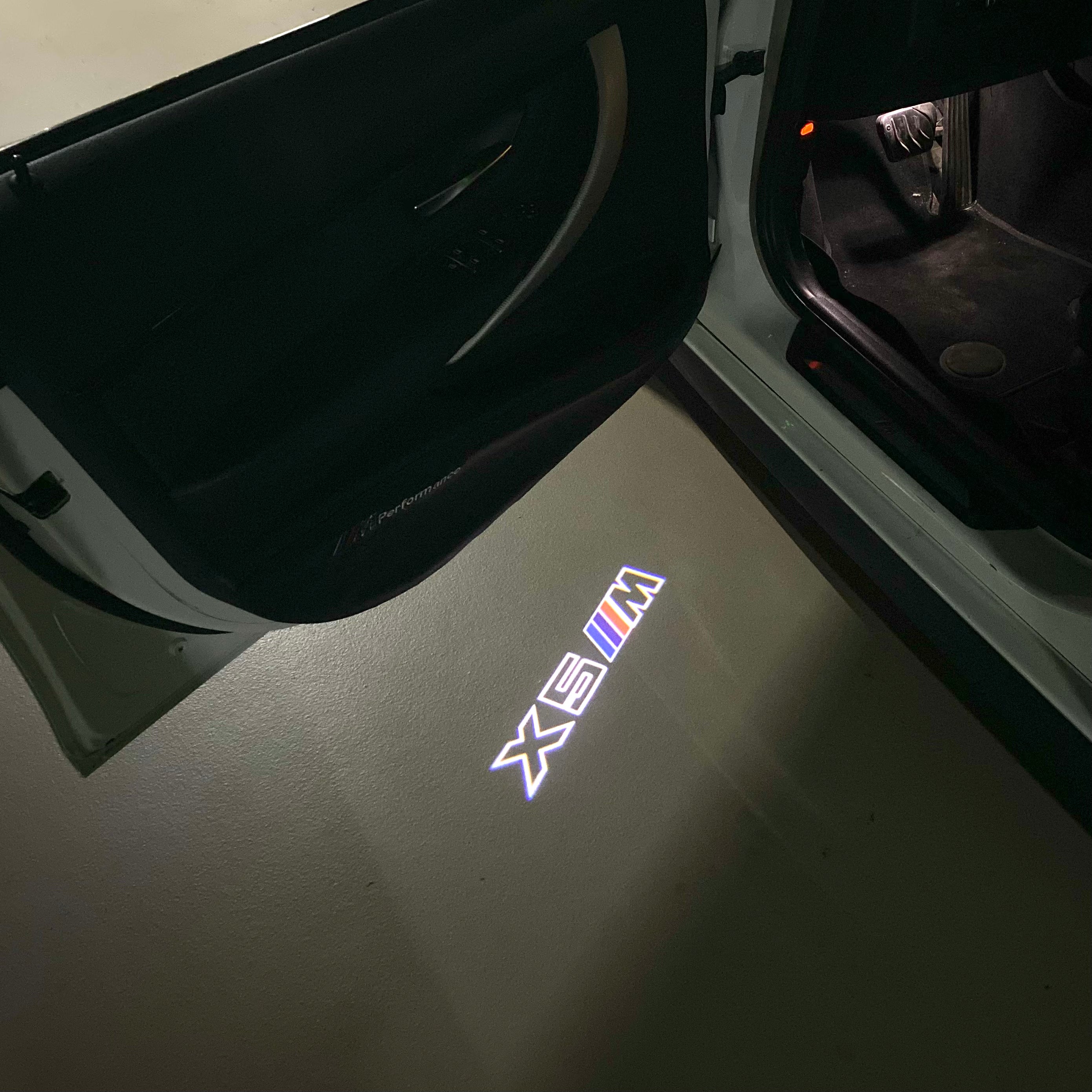 BMW X5M LOGO PROJECTOT LIGHTS (quantity 1 = 1 sets/2 door lights)Nr.bmw00108