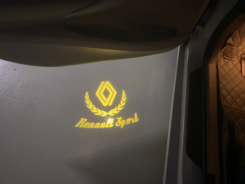 RENAULT ORIGINAL LOGO PROJECTOT LIGHTS Nr.28087(quantità 1 = 2 pellicole logo /2 luci porta) 