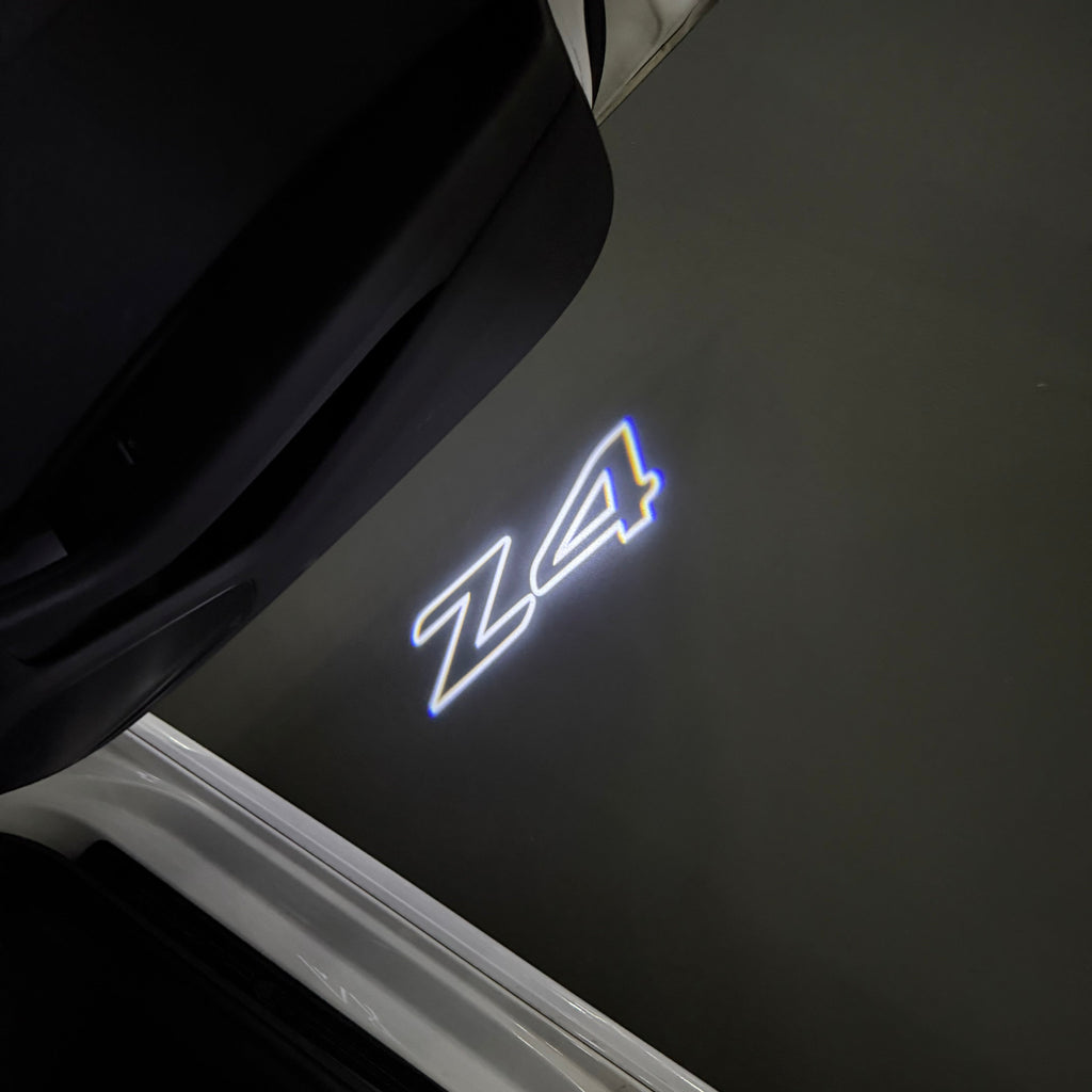 BMW Z4    LOGO PROJECTOT LIGHTS (quantity 1 = 1 sets/2 door lights)Nr.bmw00147
