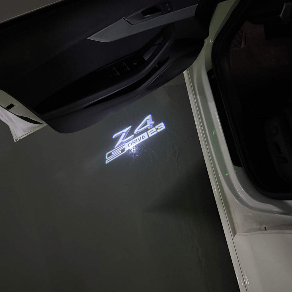 BMW   Z4 S drive LOGO PROJECTOT LIGHTS (quantity 1 = 1 sets/2 door lights)Nr.bmw00145