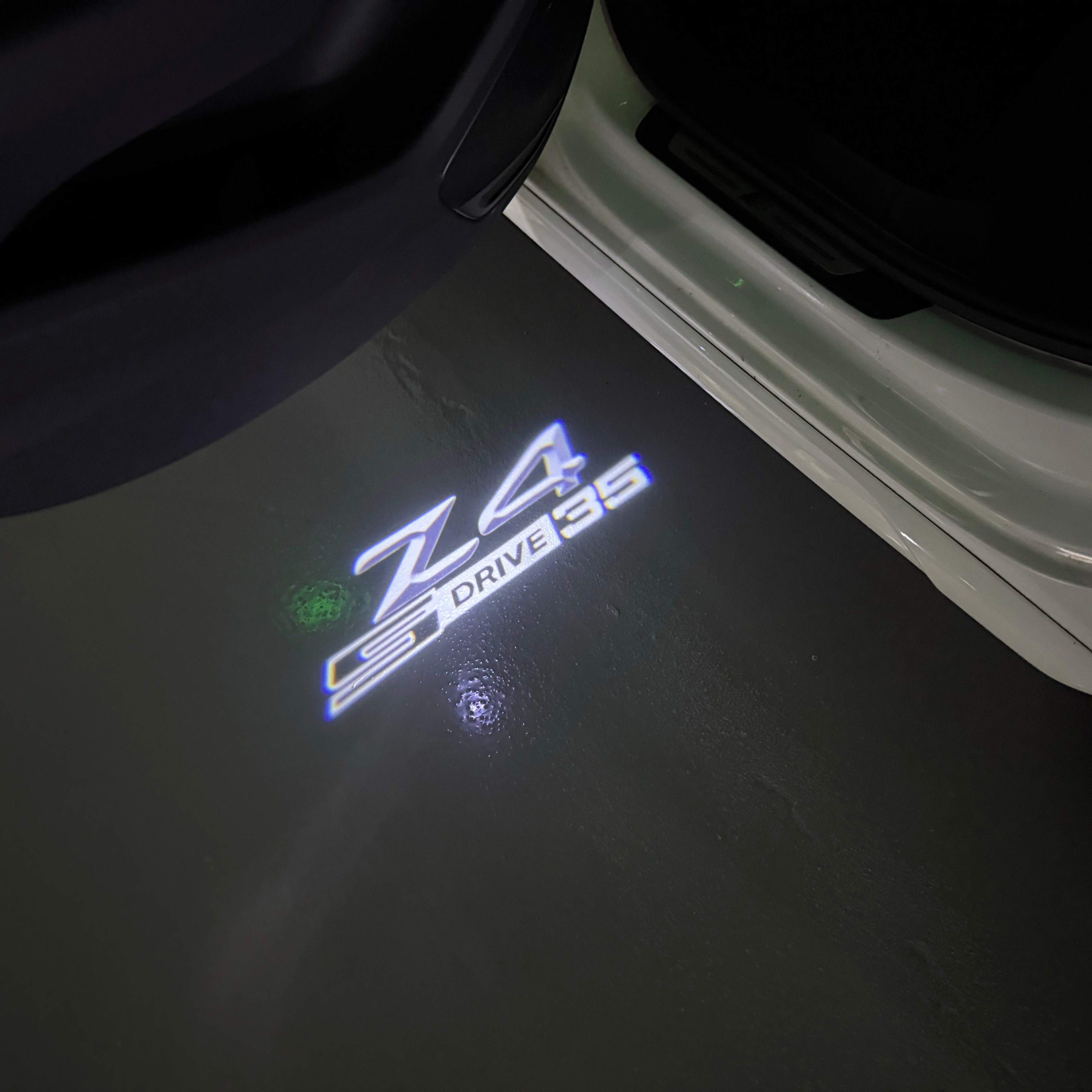 BMW  Z4 S drive  LOGO PROJECTOT LIGHTS (quantity 1 = 1 sets/2 door lights)Nr.bmw00152