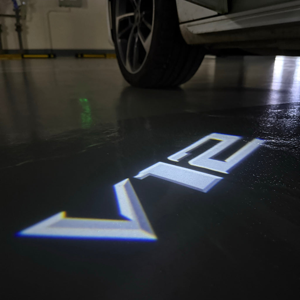 BMW 7 SERIES V12  LOGO PROJECTOT LIGHTS (quantity 1 = 1 sets/2 door lights)Nr.bmw00325