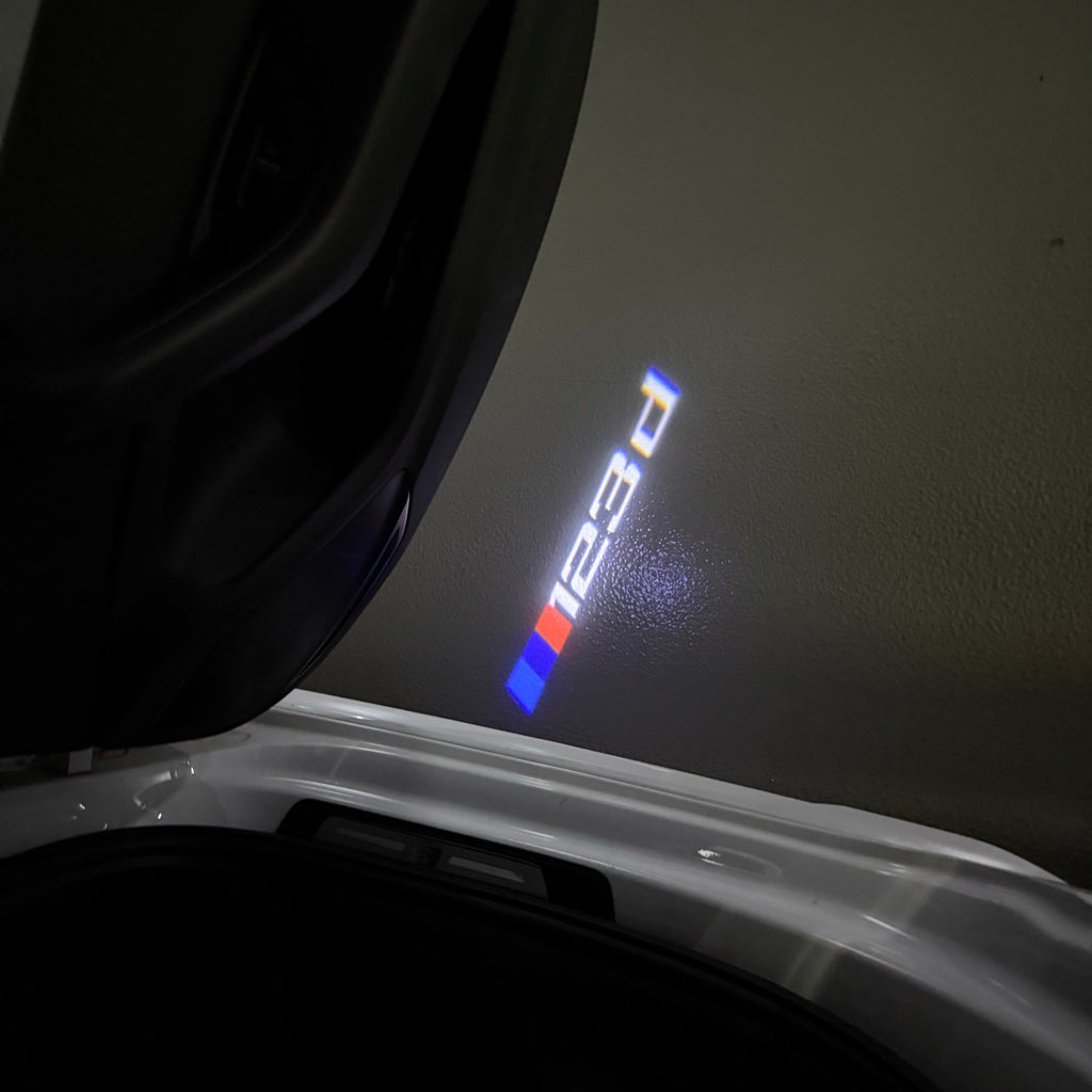 BMW 1 SERIES  123  LOGO PROJECTOT LIGHTS (quantity 1 = 1 sets/2 door lights)Nr.bmw00219