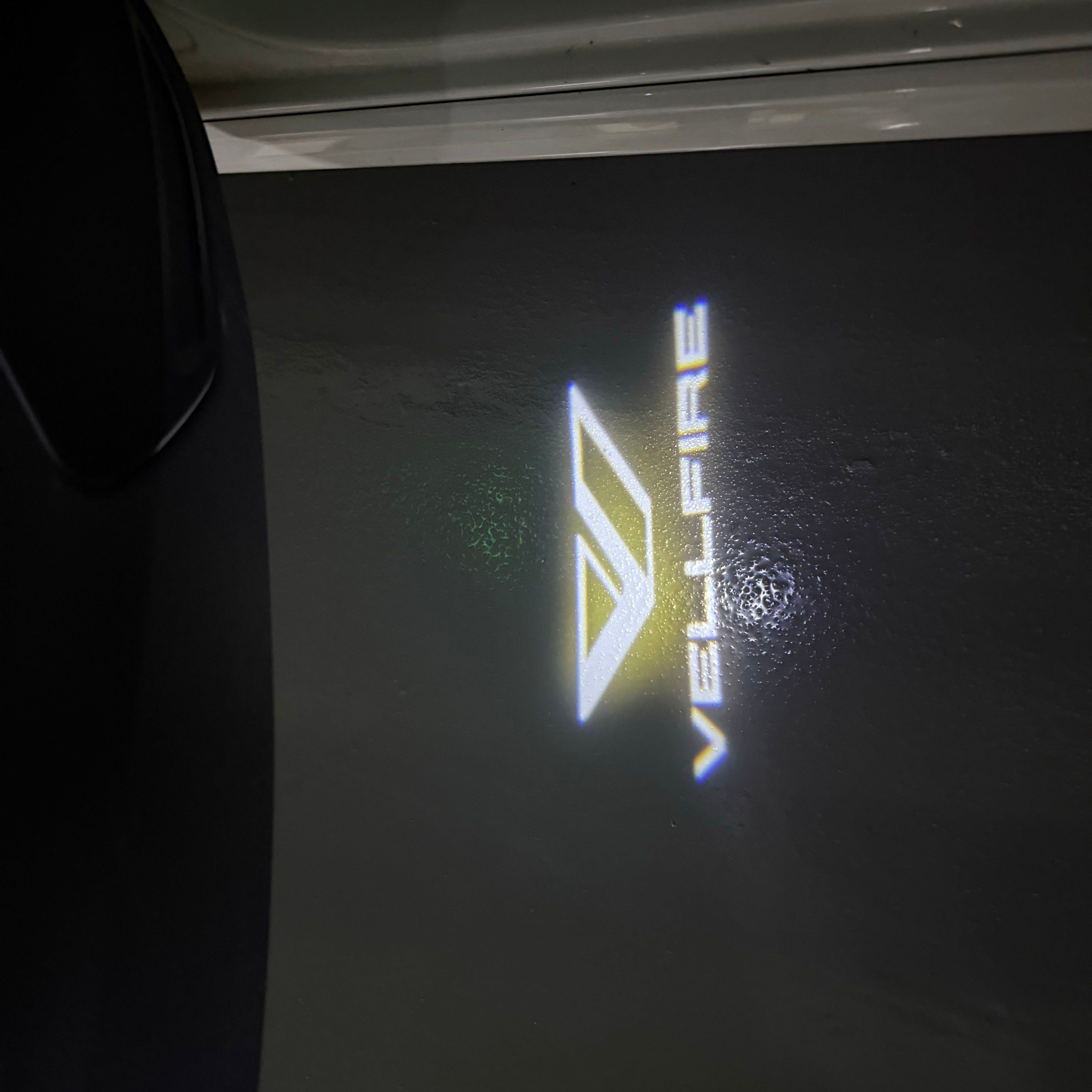 Toyota VELLFIRE LOGO PROJECROTR LIGHTS Nr.02 (quantity 1 = 1 sets/2 door lights)T88