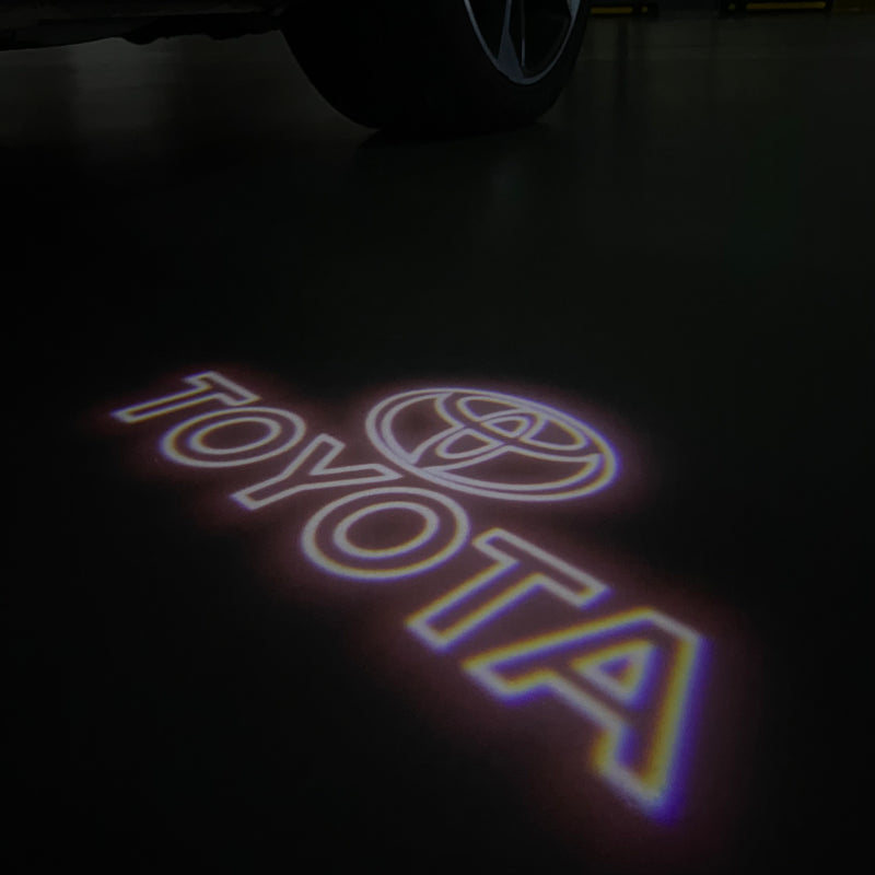 Toyota  Orignal LOGO PROJECROTR LIGHTS Nr.02 (quantity 1 = 1 sets/2 door lights)T74