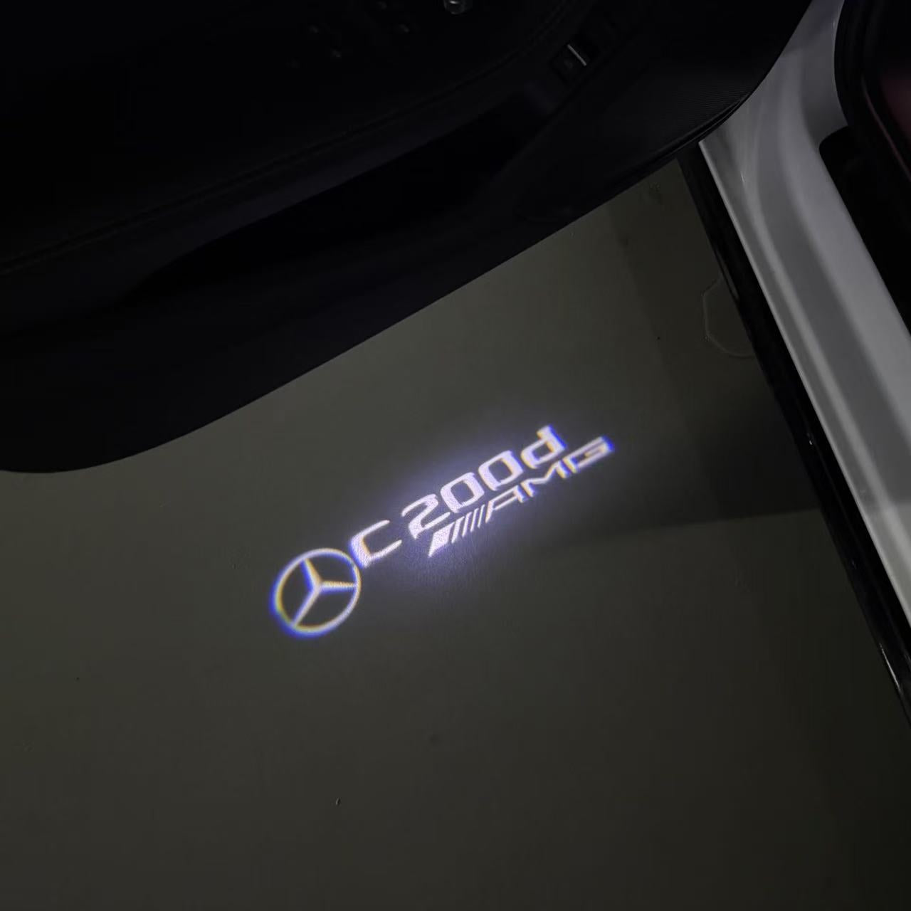 MERCEDES BENZ C200d LOGO PROJECTOT LIGHTS  (quantity 1 = 1 set /2 door lights with 2 logo films)Nr.02M64