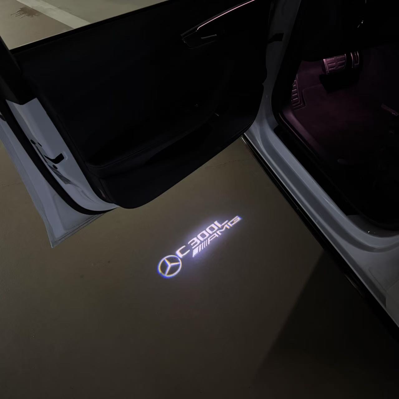 MERCEDES BENZ C300L LOGO PROJECTOT LIGHTS  (quantity 1 = 1 set /2 door lights with 2 logo films)Nr.02M43