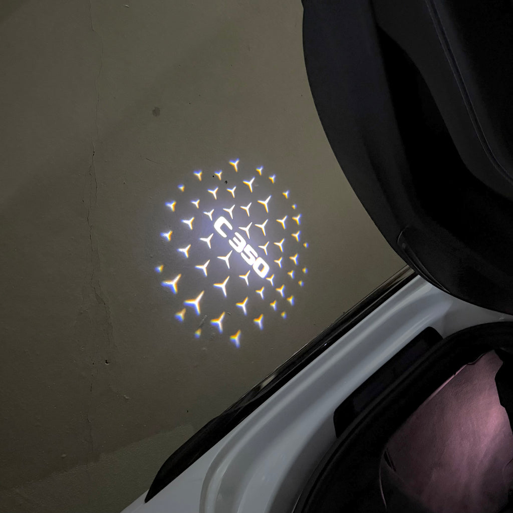 MERCEDES BENZ C350 LOGO PROJECTOT LIGHTS  (quantity 1 = 1 set /2 door lights with 2 logo films)Nr.02M54