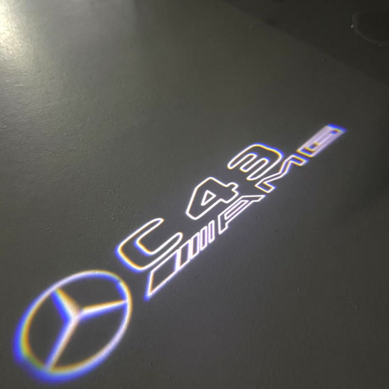 MERCEDES BENZ C43 AMG LOGO PROJECTOT LIGHTS  (quantity 1 = 1 set /2 door lights with 2 logo films)Nr.02M292