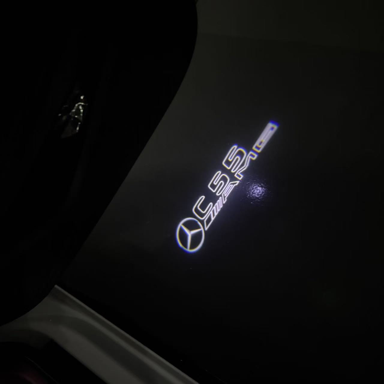 MERCEDES BENZ C55 AMG LOGO PROJECTOT LIGHTS  (quantity 1 = 1 set /2 door lights with 2 logo films)Nr.02M301