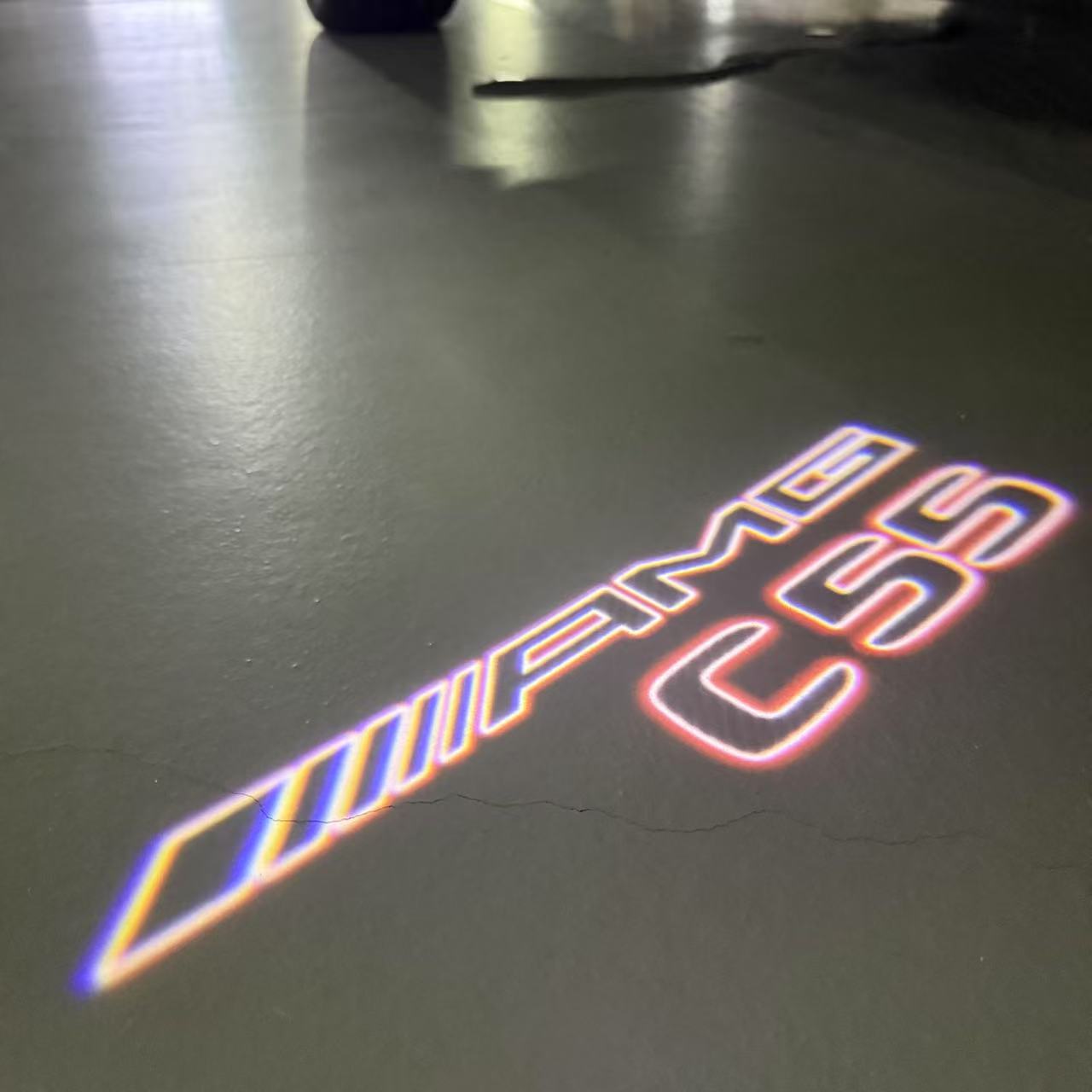 MERCEDES BENZ C55 AMG LOGO PROJECTOT LIGHTS  (quantity 1 = 1 set /2 door lights with 2 logo films)Nr.02M300