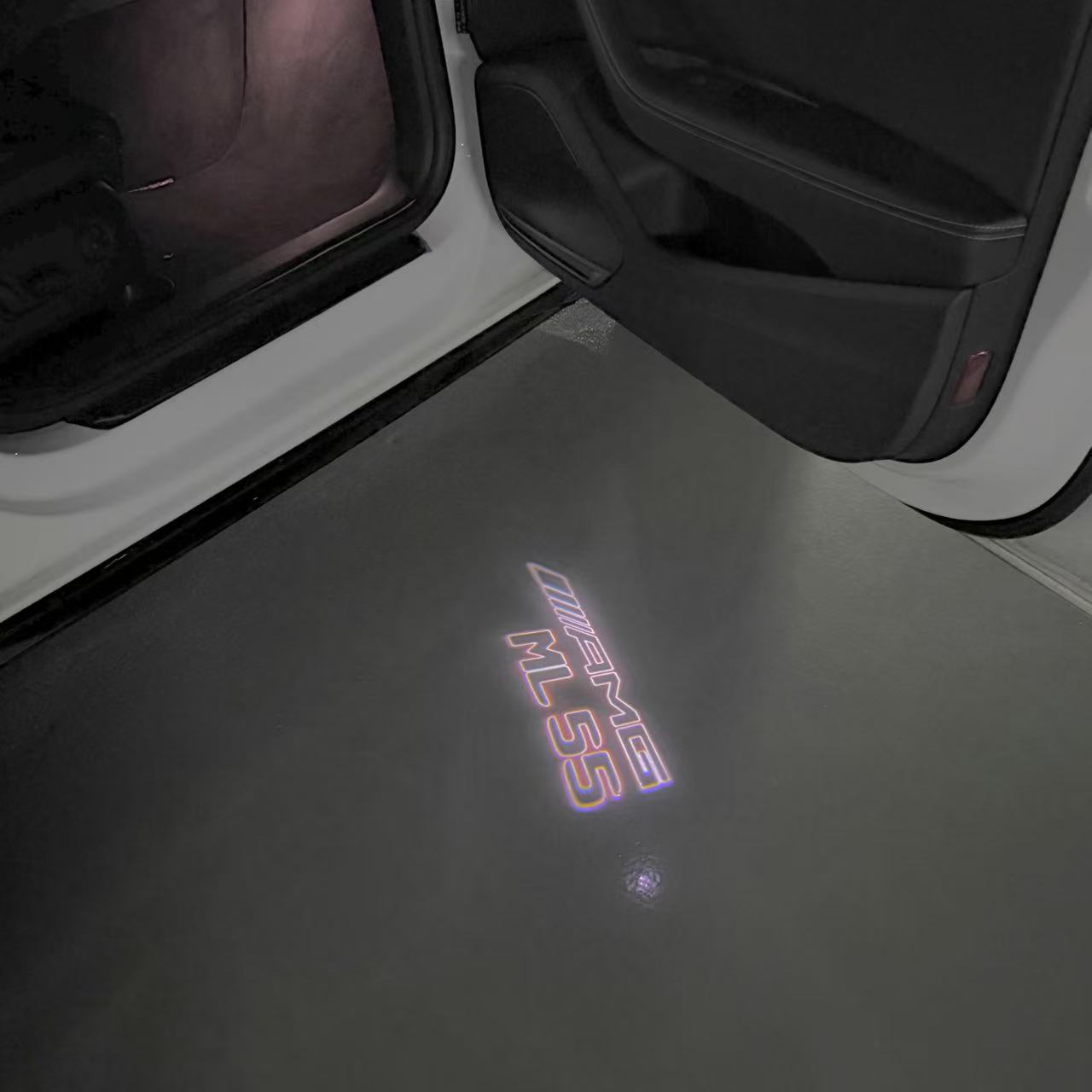 MERCEDES BENZ ML55 AMG LOGO PROJECTOT LIGHTS  (quantity 1 = 1 set /2 door lights with 2 logo films)Nr.02M383