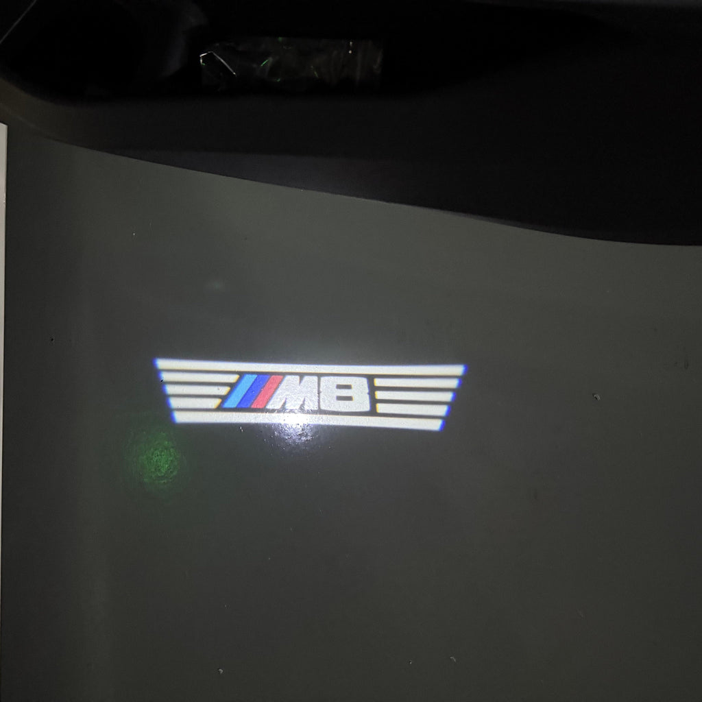 BMW  8 SERIES M8  LOGO PROJECTOT LIGHTS (quantity 1 = 1 sets/2 door lights)Nr.bmw00302