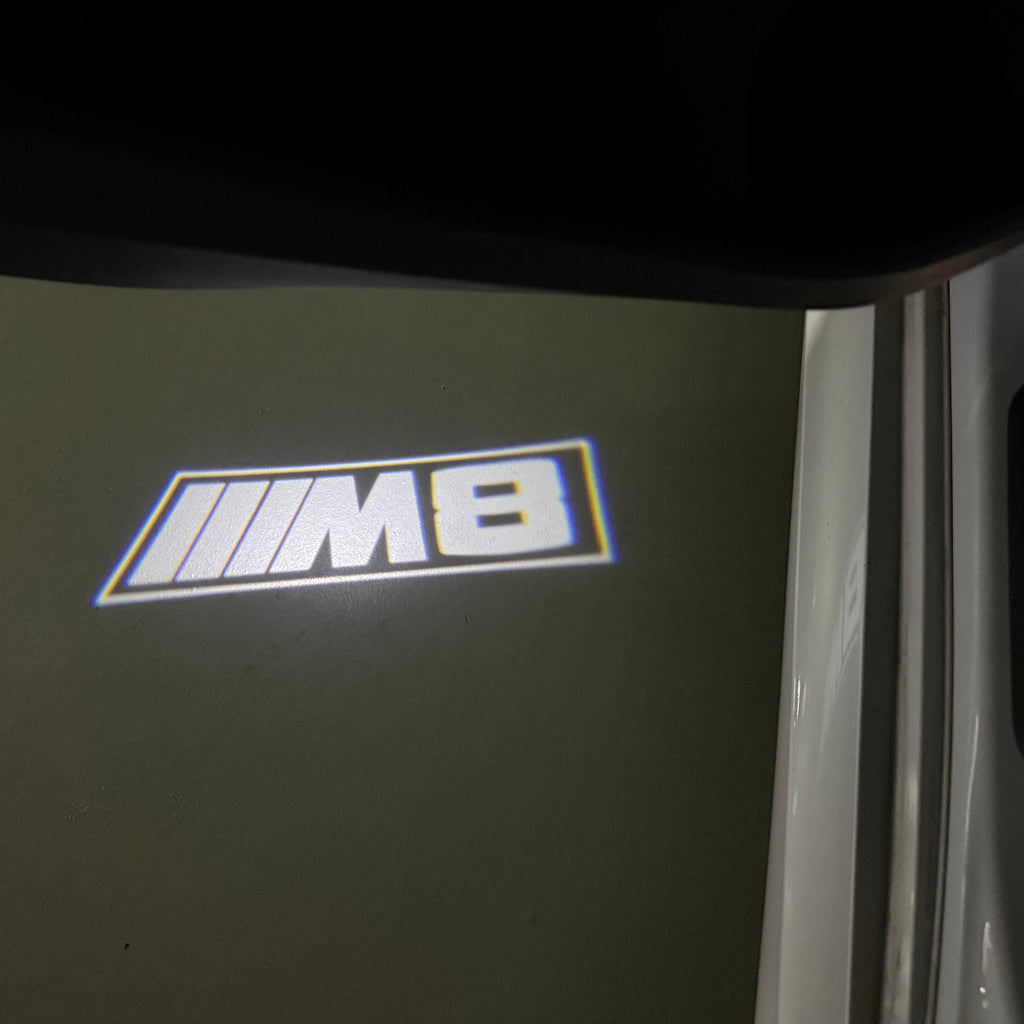 BMW 8 SERIES M8   LOGO PROJECTOT LIGHTS (quantity 1 = 1 sets/2 door lights)Nr.bmw00304