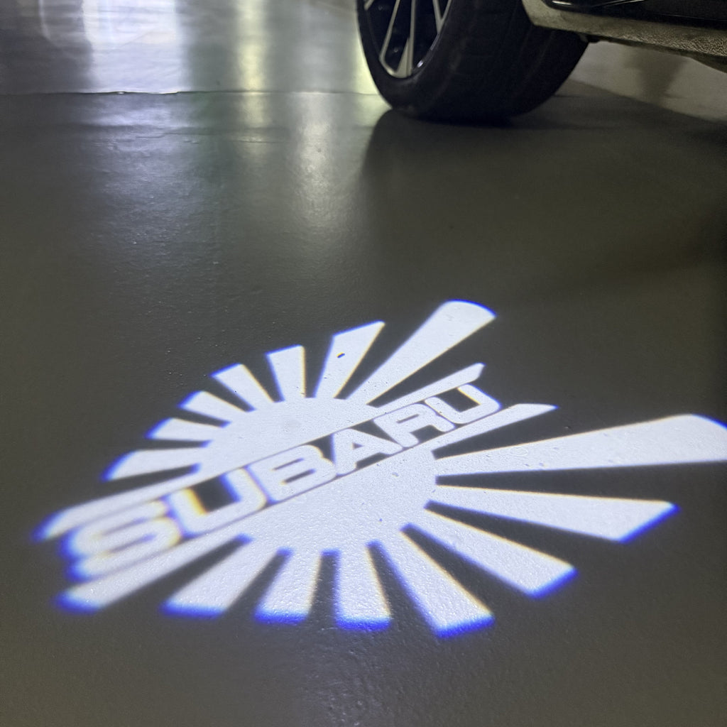 SUBARU Original LOGO PROJECROTR LIGHTS (quantity 1 = 1 sets/2 door lights) Nr.03d13