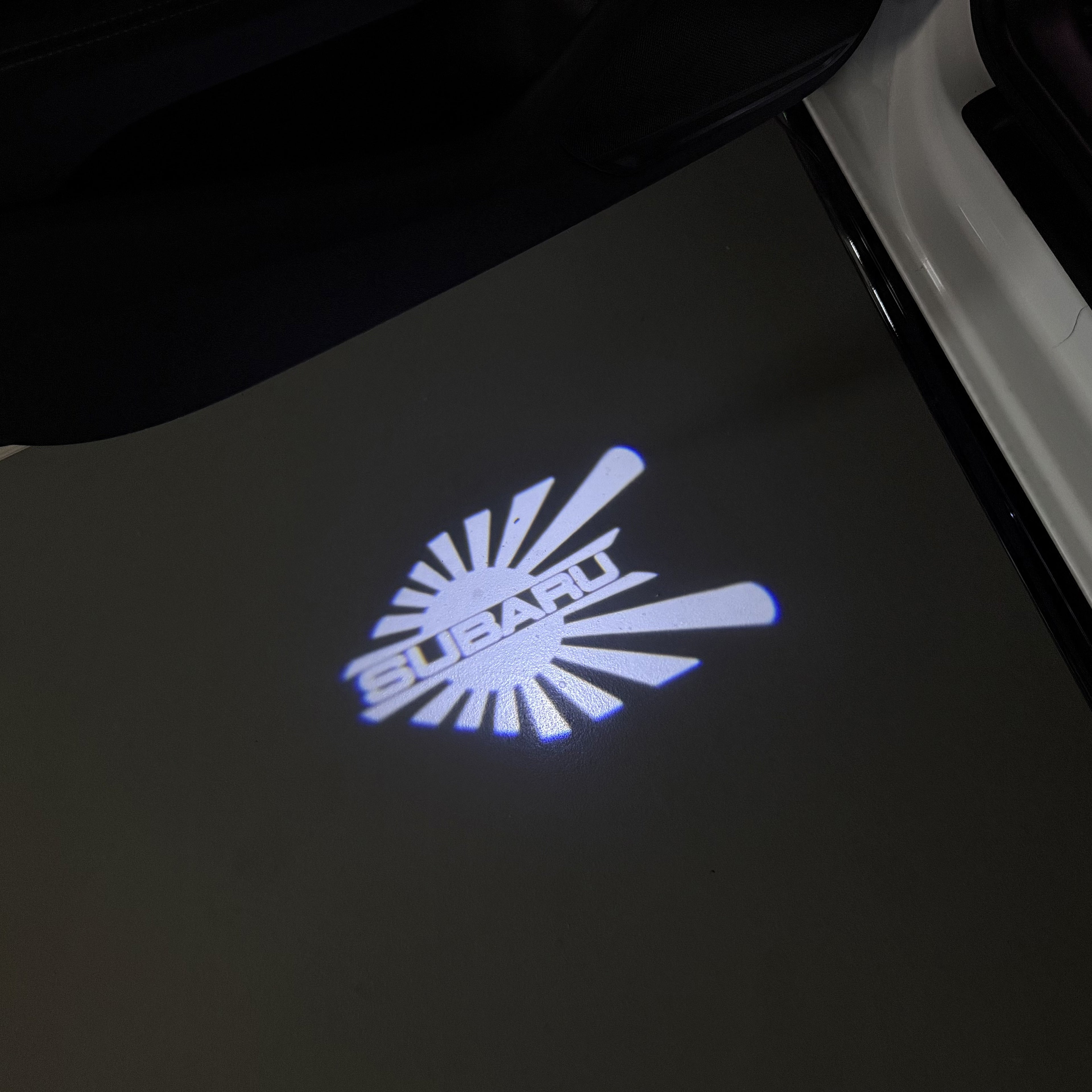 SUBARU Original LOGO PROJECROTR LIGHTS (quantity 1 = 1 sets/2 door lights) Nr.03d13