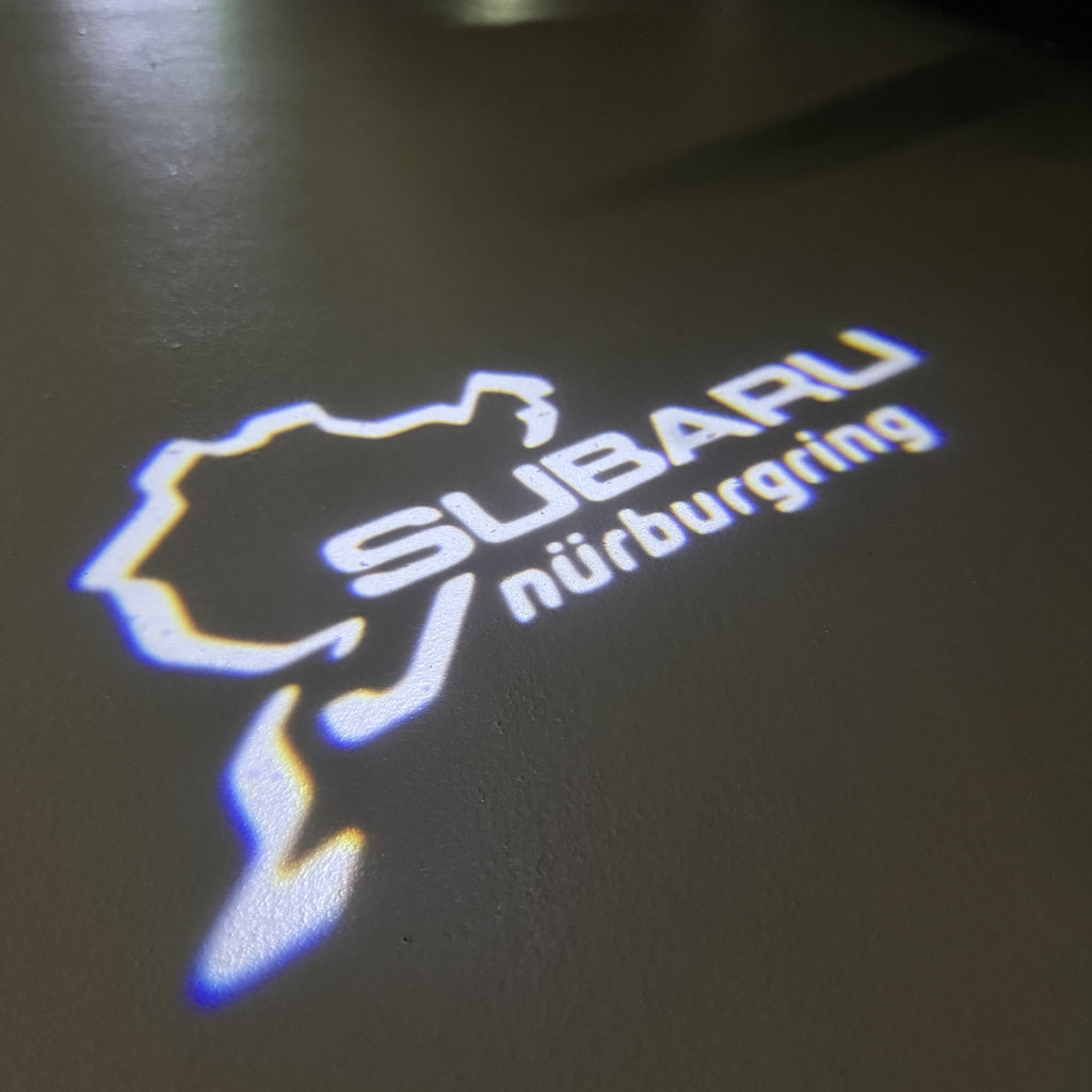 SUBARU Original LOGO PROJECROTR LIGHTS (quantity 1 = 1 sets/2 door lights) Nr.03d15