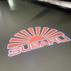 SUBARU Original LOGO PROJECROTR LIGHTS (quantity 1 = 1 sets/2 door lights) Nr.03d14