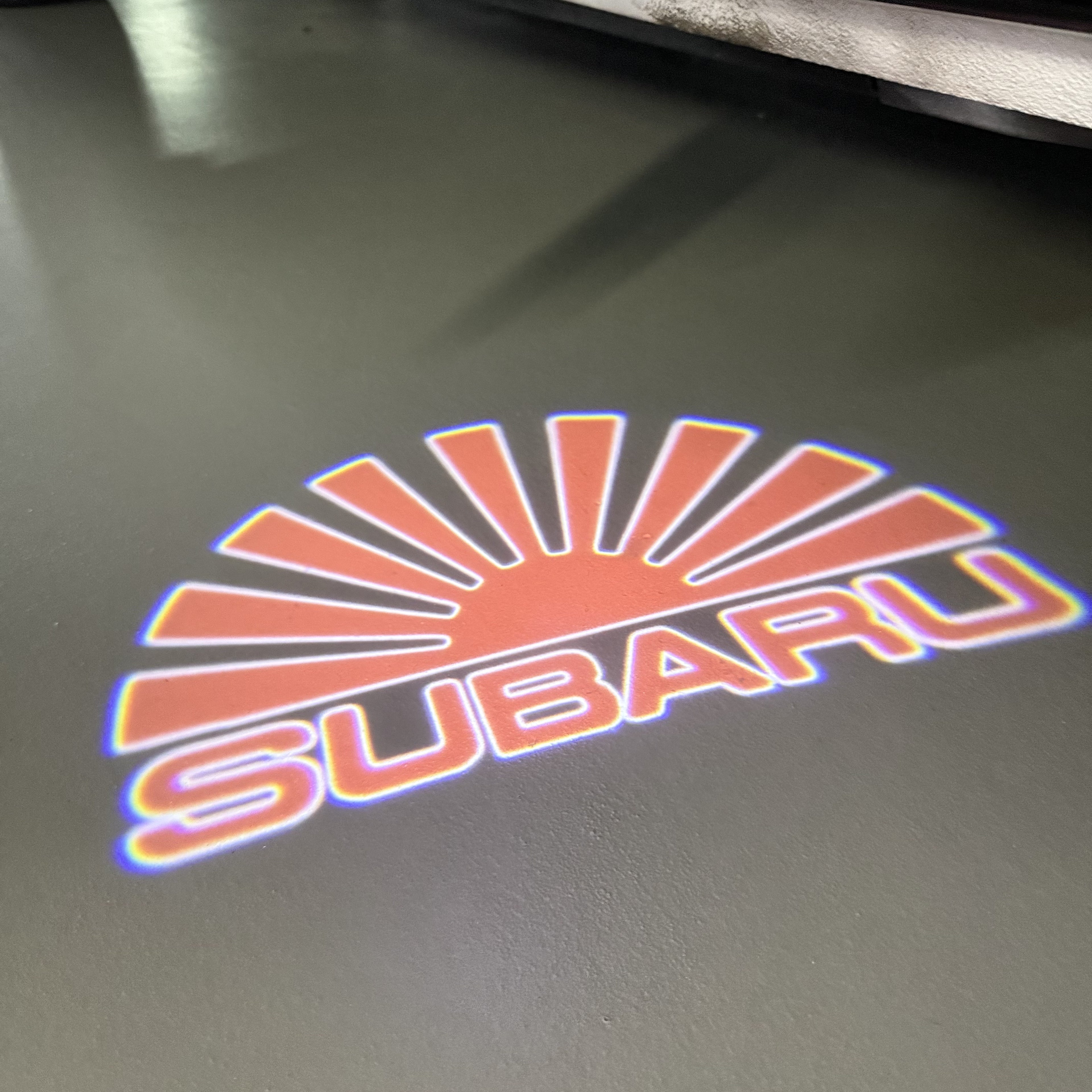 SUBARU Original LOGO PROJECROTR LIGHTS (quantity 1 = 1 sets/2 door lights) Nr.03d14