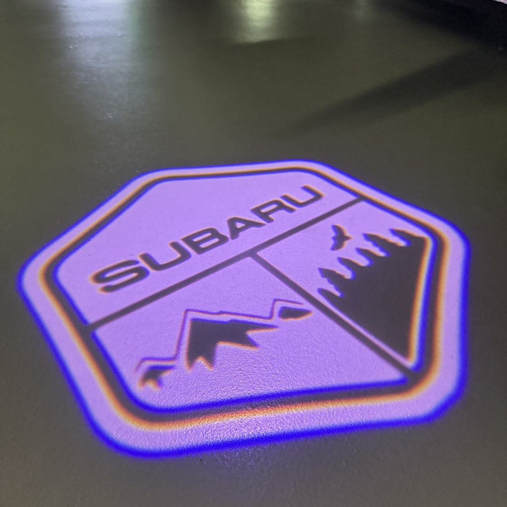 SUBARU Original LOGO PROJECROTR LIGHTS (quantity 1 = 1 sets/2 door lights) Nr.03d12