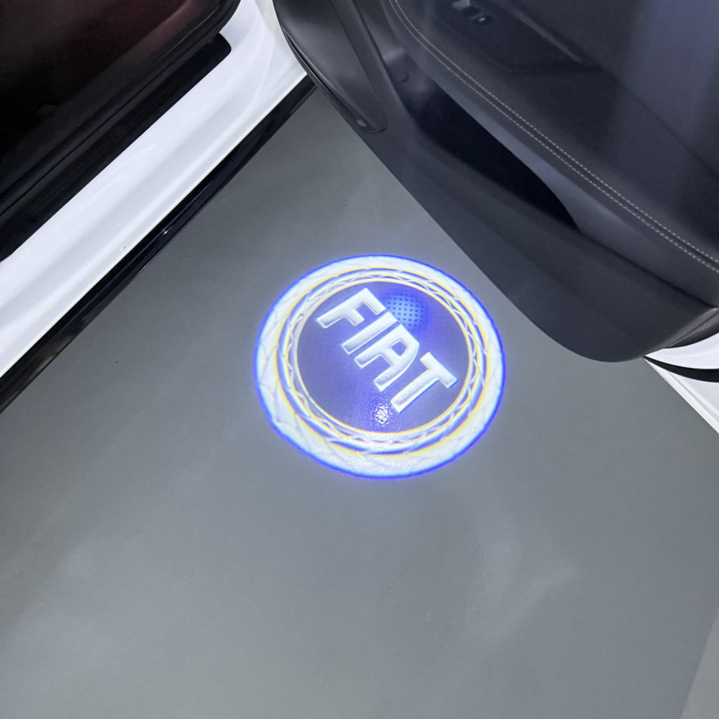 FIAT ORIGINALLOGO PROJECTOT LIGHTS  (quantity  1 =  2 Logo Film /  2 door lights)Nr.48ER28