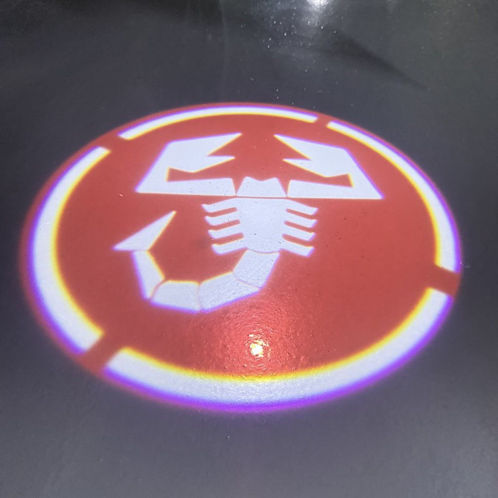 FIAT ABARTH LOGO PROJECTOT LIGHTS  (quantity  1 =  2 Logo Film /  2 door lights)Nr.48ER15