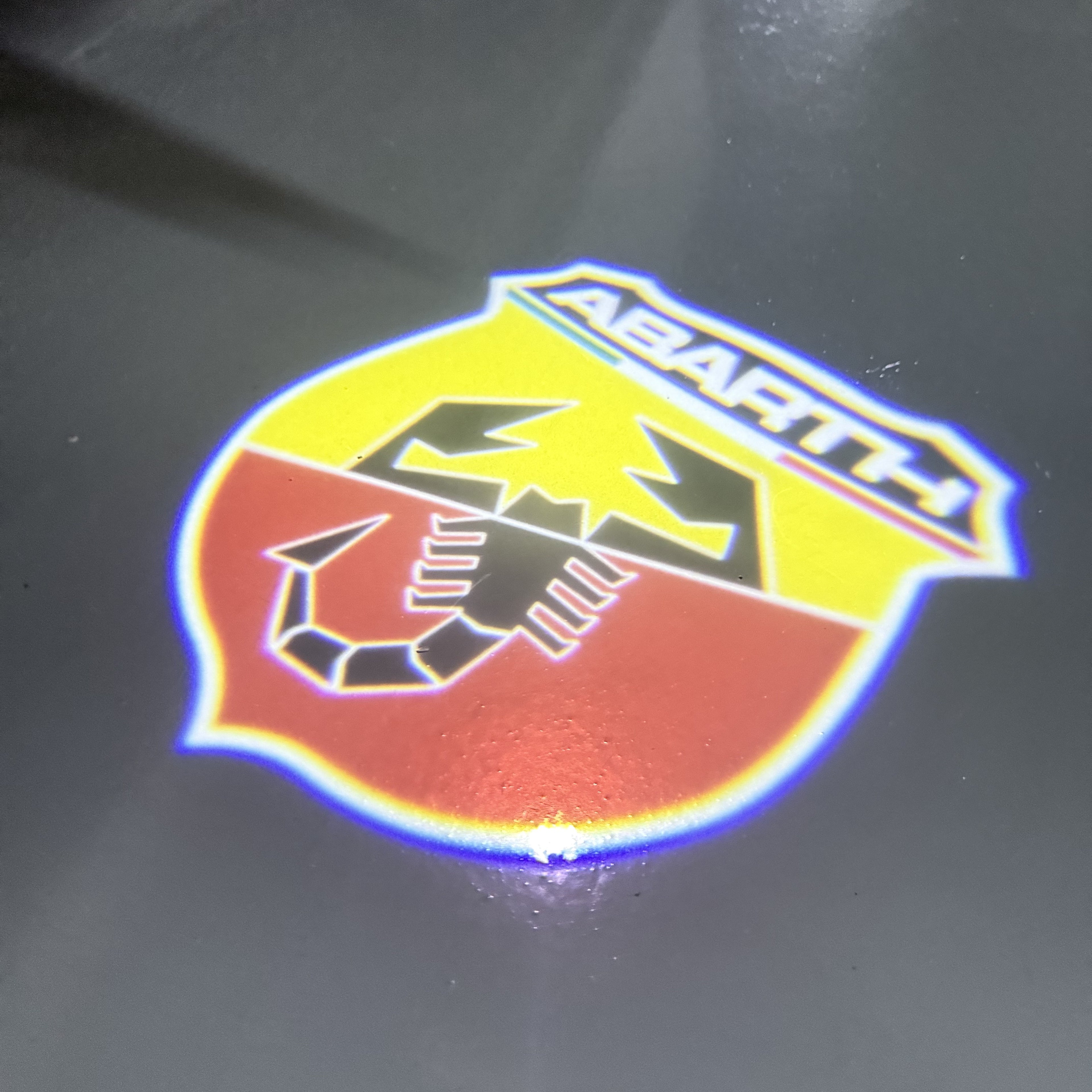 FIAT ABARTH  LOGO PROJECTOT LIGHTS  (quantity  1 =  2 Logo Film /  2 door lights)Nr.48ER04