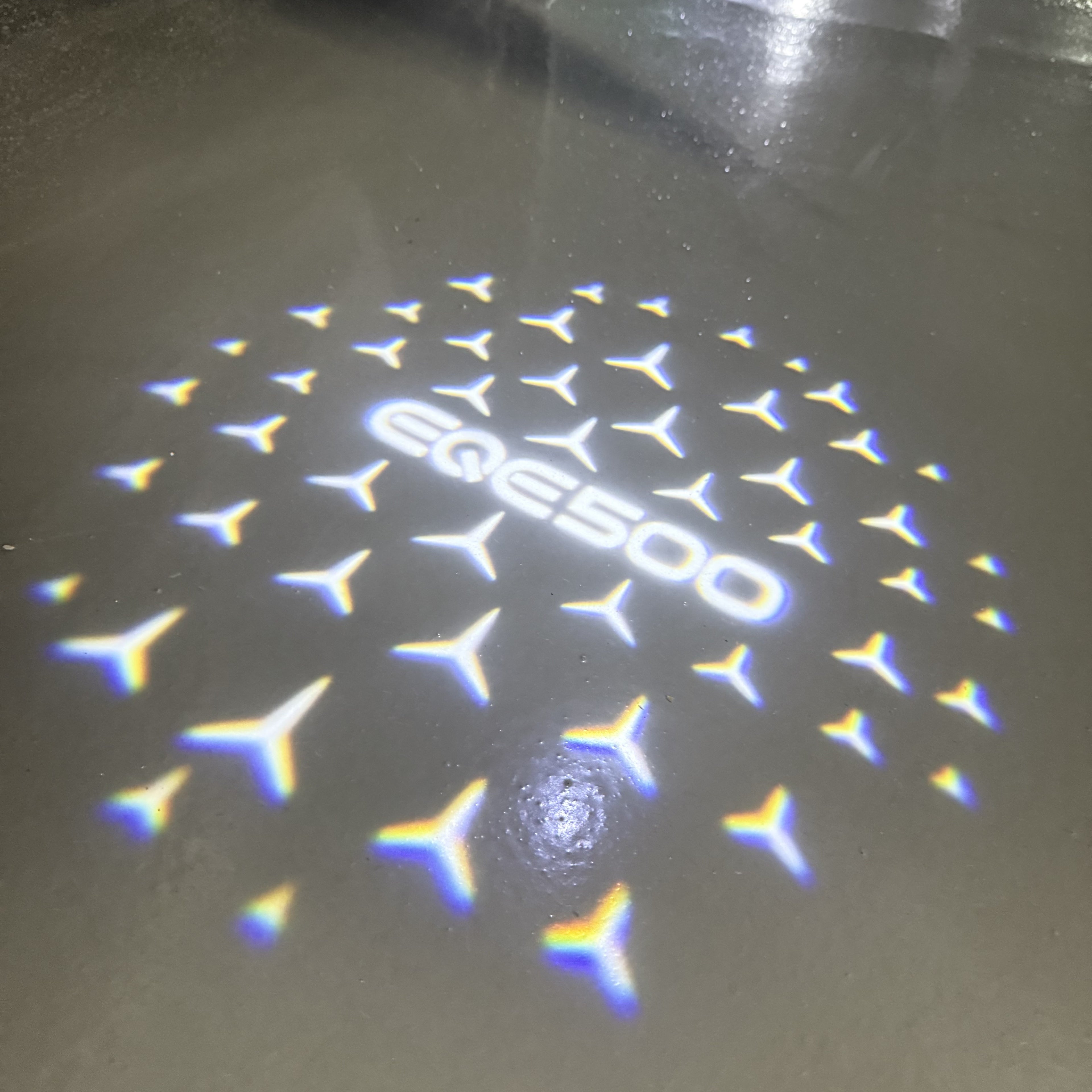 MERCEDES BENZ EQE 500 LOGO PROJECTOT LIGHTS  (quantity 1 = 1 set /2 door lights with 2 logo films)Nr.02M176