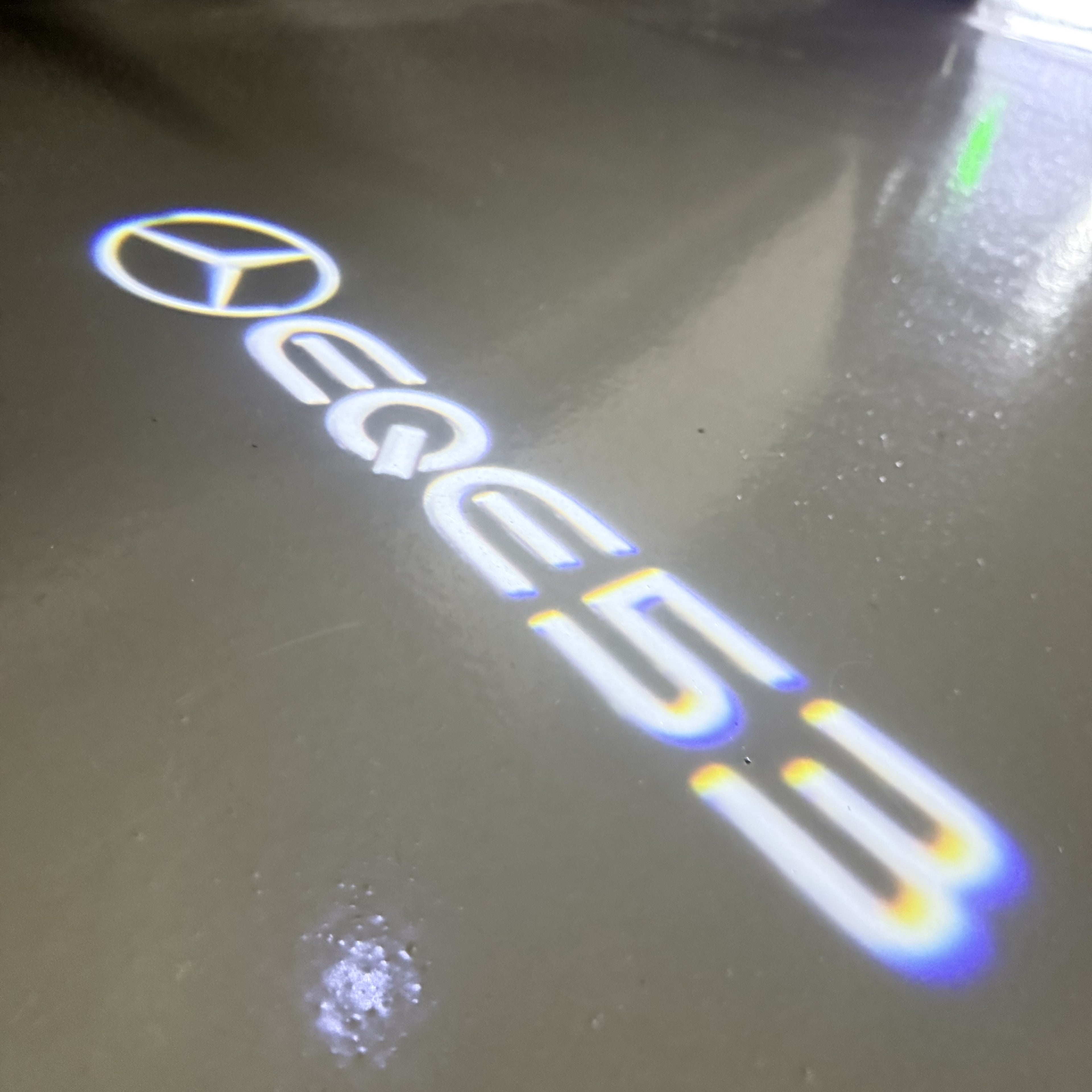 MERCEDES BENZ EQE 53 LOGO PROJECTOT LIGHTS  (quantity 1 = 1 set /2 door lights with 2 logo films)Nr.02M173