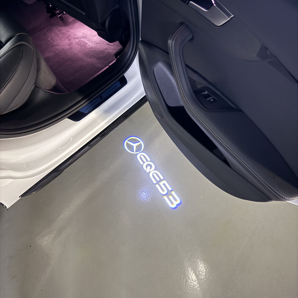 MERCEDES BENZ EQE 53 LOGO PROJECTOT LIGHTS  (quantity 1 = 1 set /2 door lights with 2 logo films)Nr.02M173
