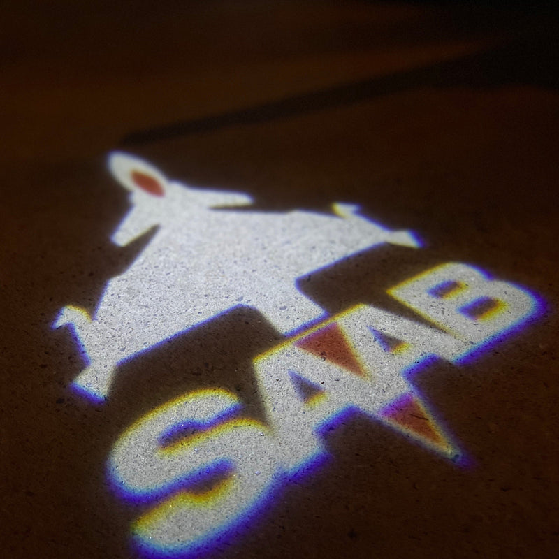 SAAB  Original LOGO PROJECROTR LIGHTS Nr.2506  (quantity 1 = 1 sets/2 door lights)