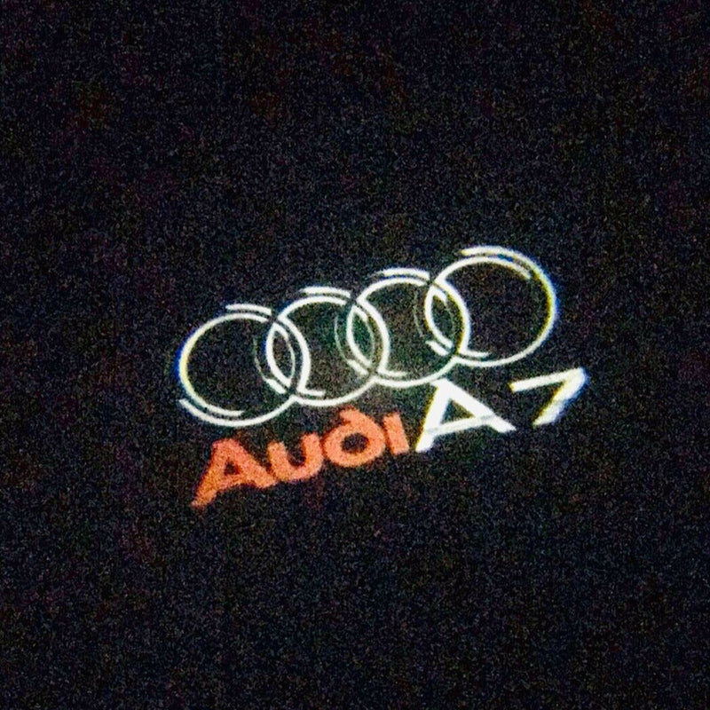 AUDI A7 LOGO PROJECTOT LIGHTS Nr.45 (quantità 1 = 2 pellicole logo /2 luci porta） 