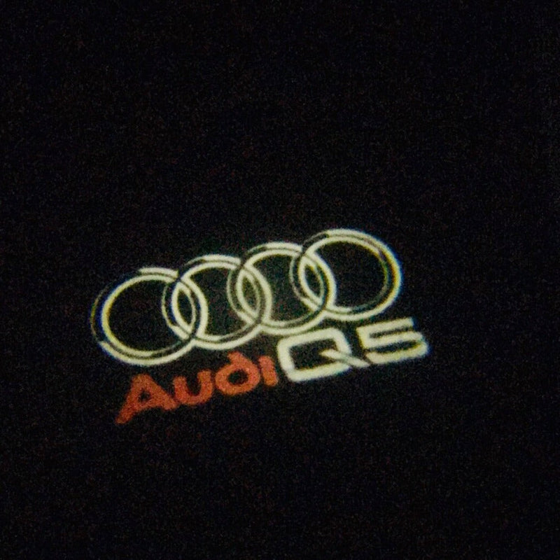 AUDI Q5 LOGO PROJECTOT LIGHTS Nr.48 (quantità 1 = 2 pellicole logo /2 luci porta） 