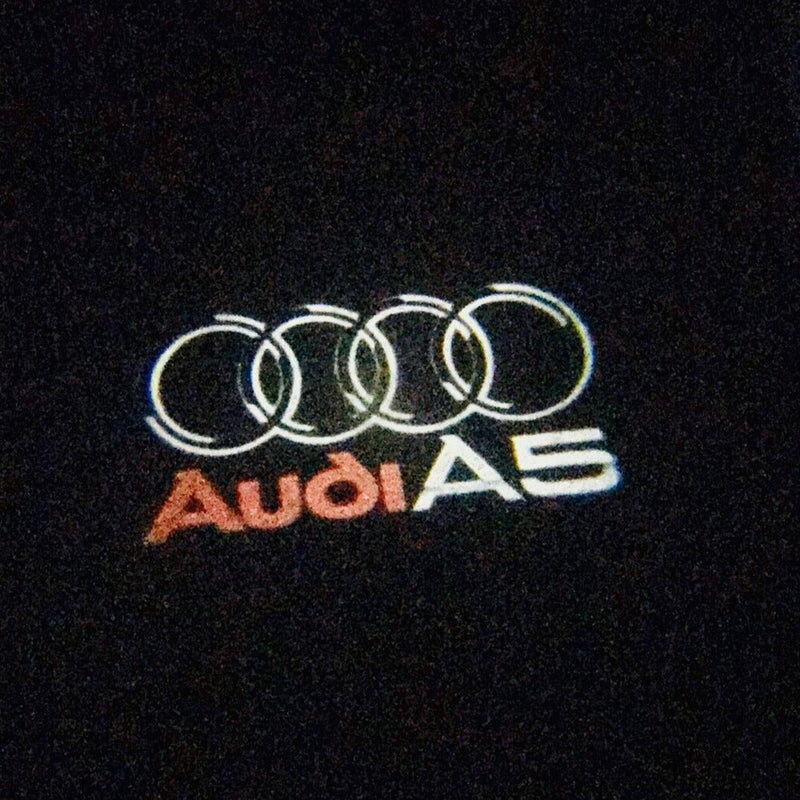 AUDI A5 LOGO PROJECTOT LIGHTS Nr.43 (quantità 1 = 2 pellicole logo /2 luci porta） 